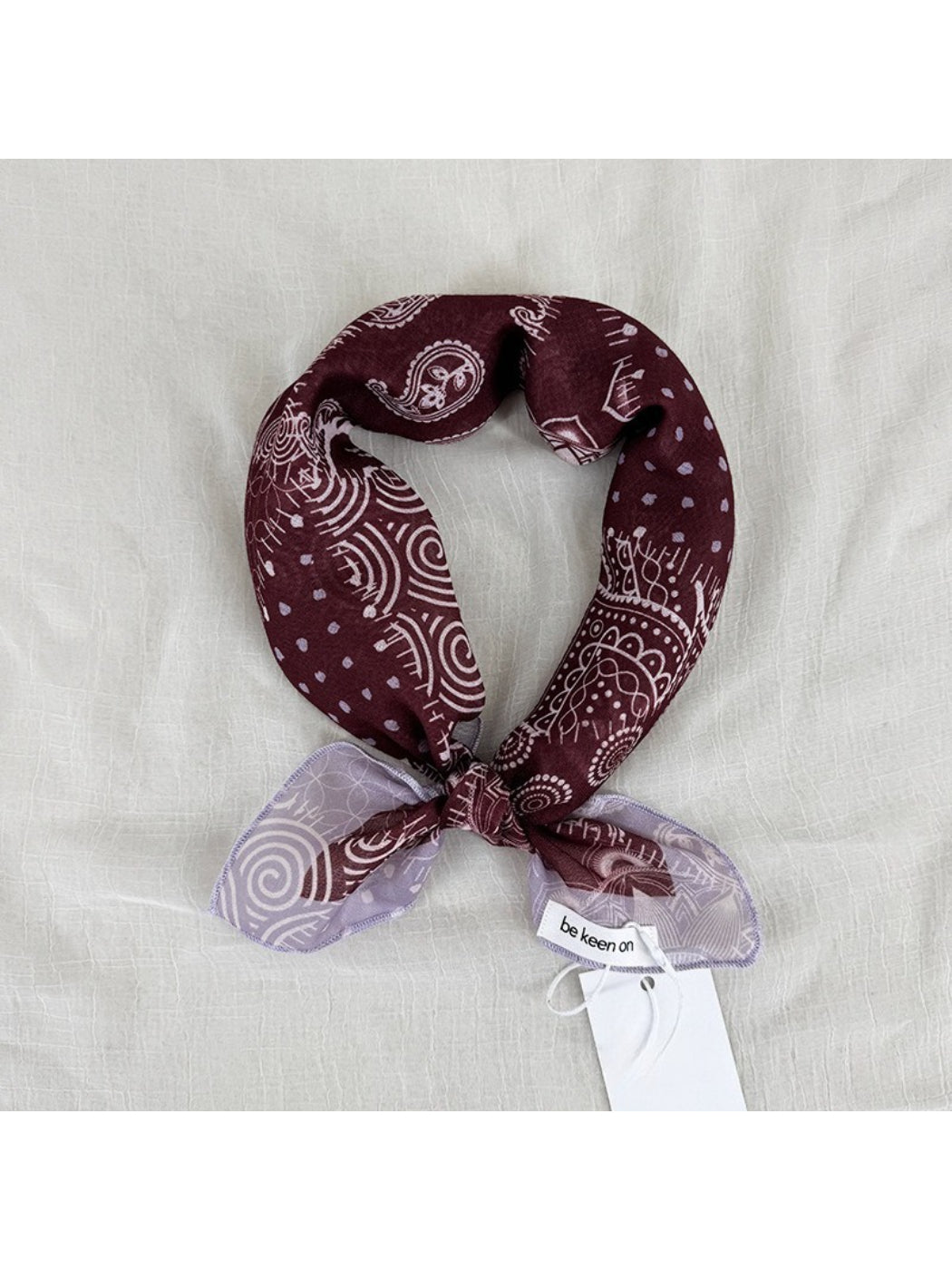 Scarvii Patchwork Paisley Square Scarf folded showing mixed paisley and floral patterns in blue and red tones