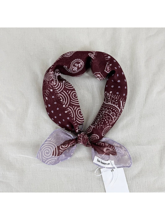 Scarvii Patchwork Paisley Square Scarf folded showing mixed paisley and floral patterns in blue and red tones