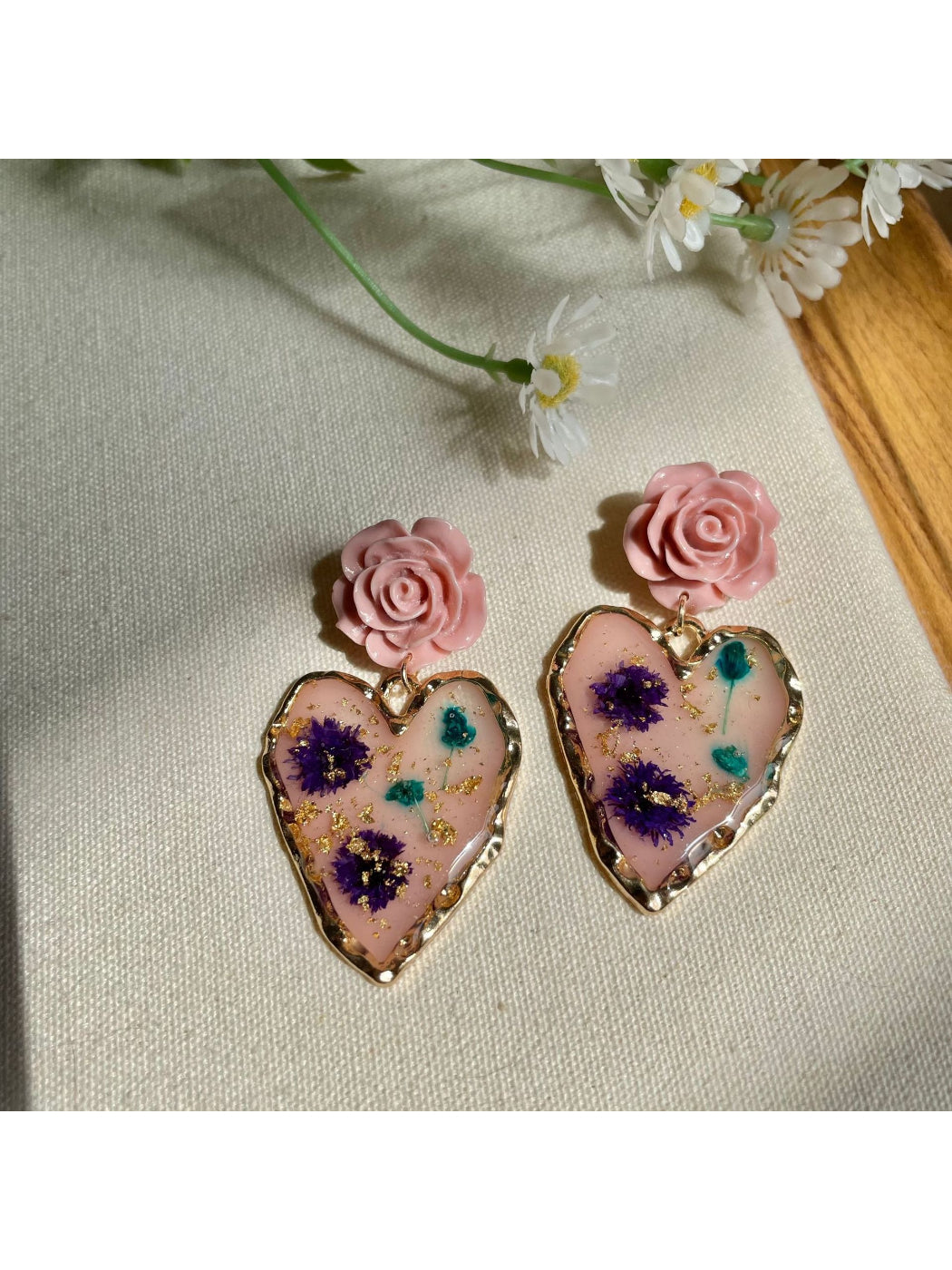 Side view of Earwish Rose Heart Drop Earrings highlighting the drop design and clasp