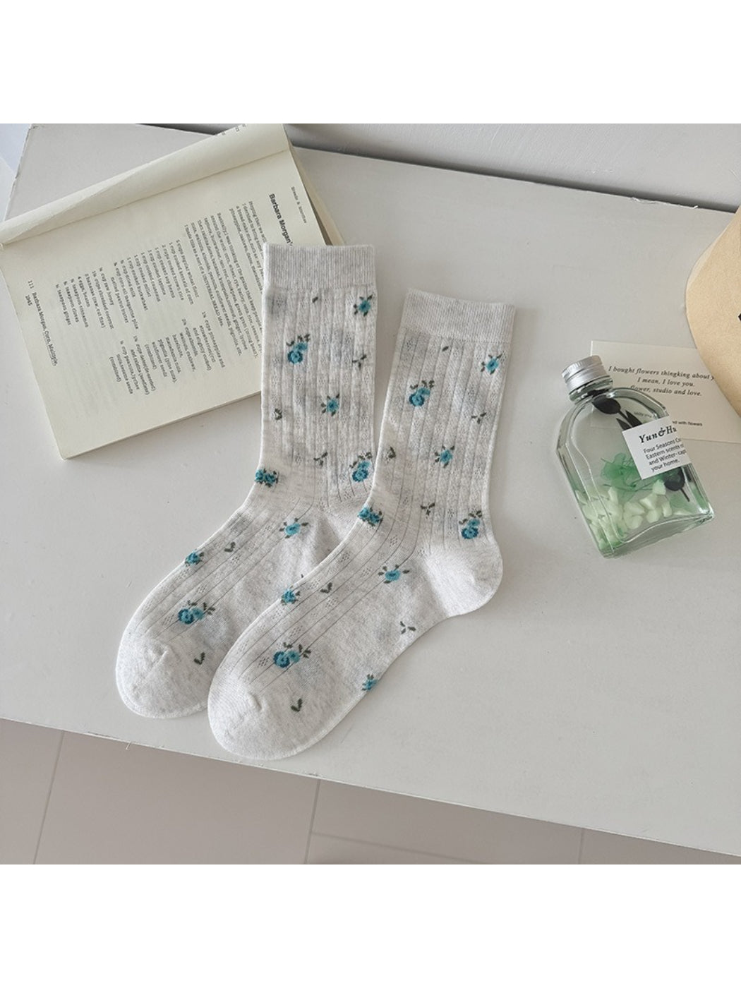 Side view of Rufia floral ribbed crew socks highlighting ankle length