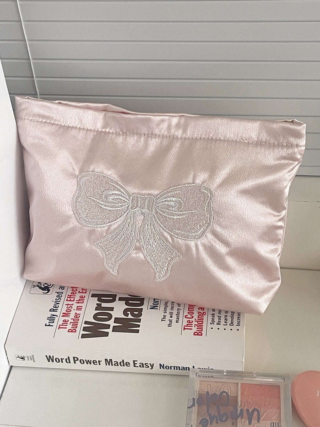 Cosbai cosmetic pouch showing the spacious interior with makeup items inside