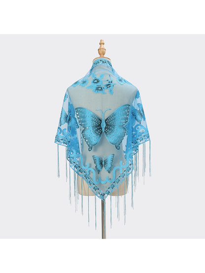 Model wearing Scarvii Butterfly Fringe Triangle Scarf styled as a shawl with fringed edges