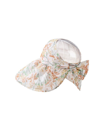 Pastel bloom wide brim hat folded to show flexibility and fabric quality