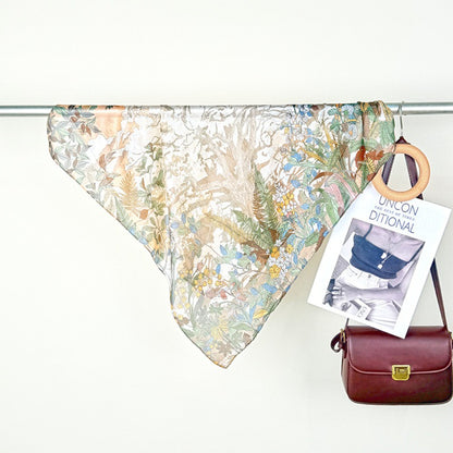 Scarvii Botanical Scene Square Scarf styled as a headscarf with visible botanical print