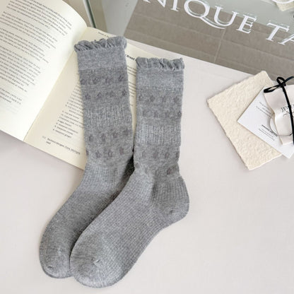 Top view of Rufia floral trim ribbed crew socks showing scalloped floral trim and ribbed pattern