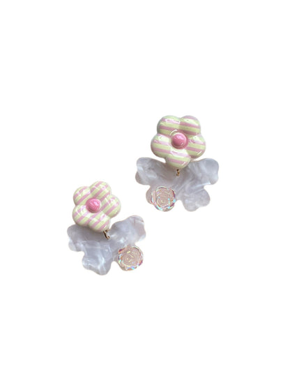 Earwish Stripe Flower Bow Earrings worn on a model's ear highlighting size and style