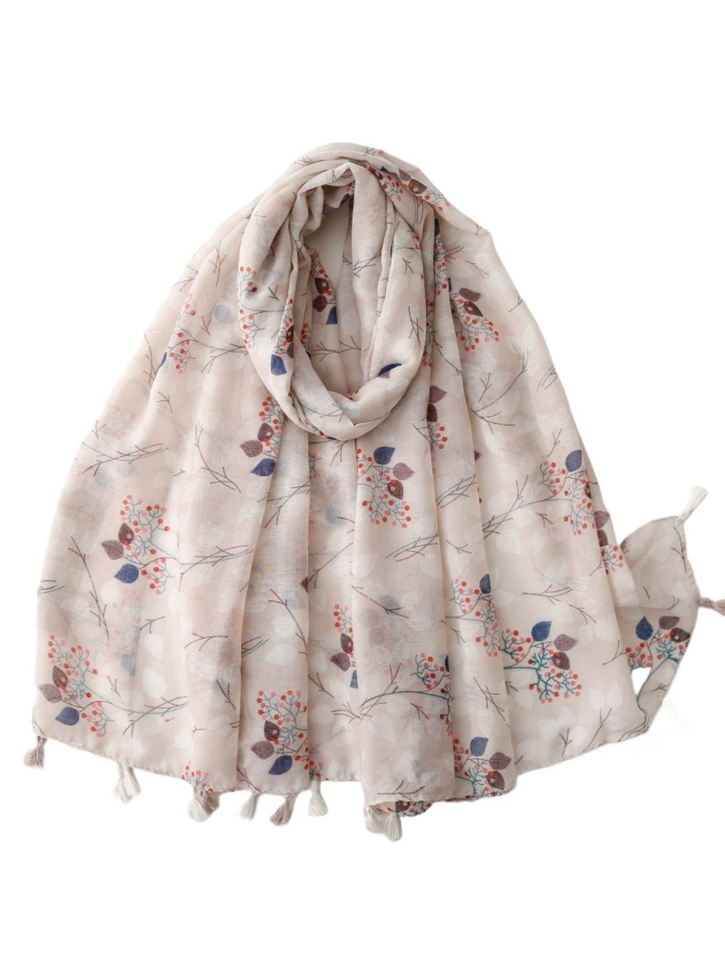 Soft botanical print scarf draped on a white background showing floral design