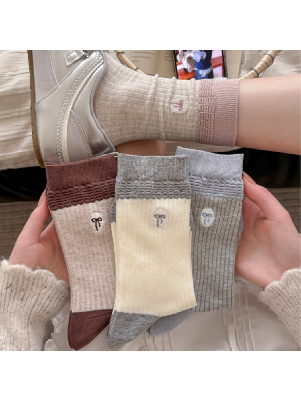 Rufia embroidered ribbon ribbed slouch socks in white laid flat on a white background