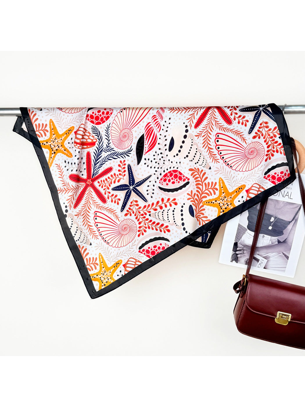 Scarvii scarf styled as a headband showing detailed seaside design