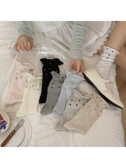 Rufia ruffle mesh dot mid-calf socks displayed flat showing dot pattern and ruffle trim