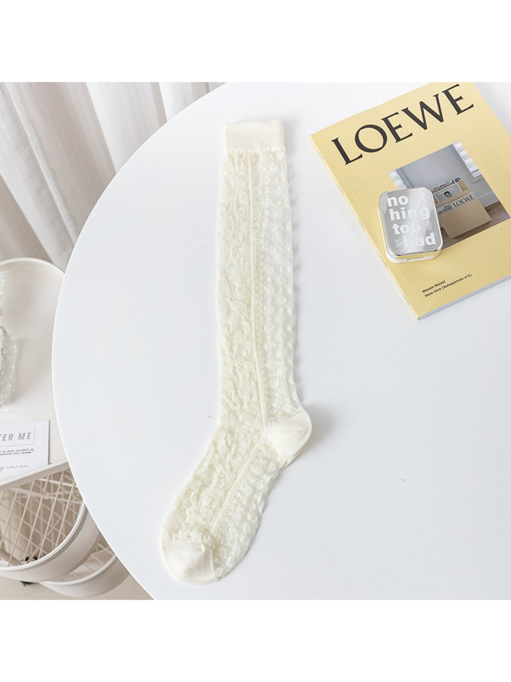 Rufia lace floral knee high socks styled with a skirt and heels