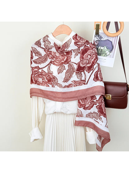 Close-up of floral pattern on Scarvii wrap scarf showing detailed flowers and leaves
