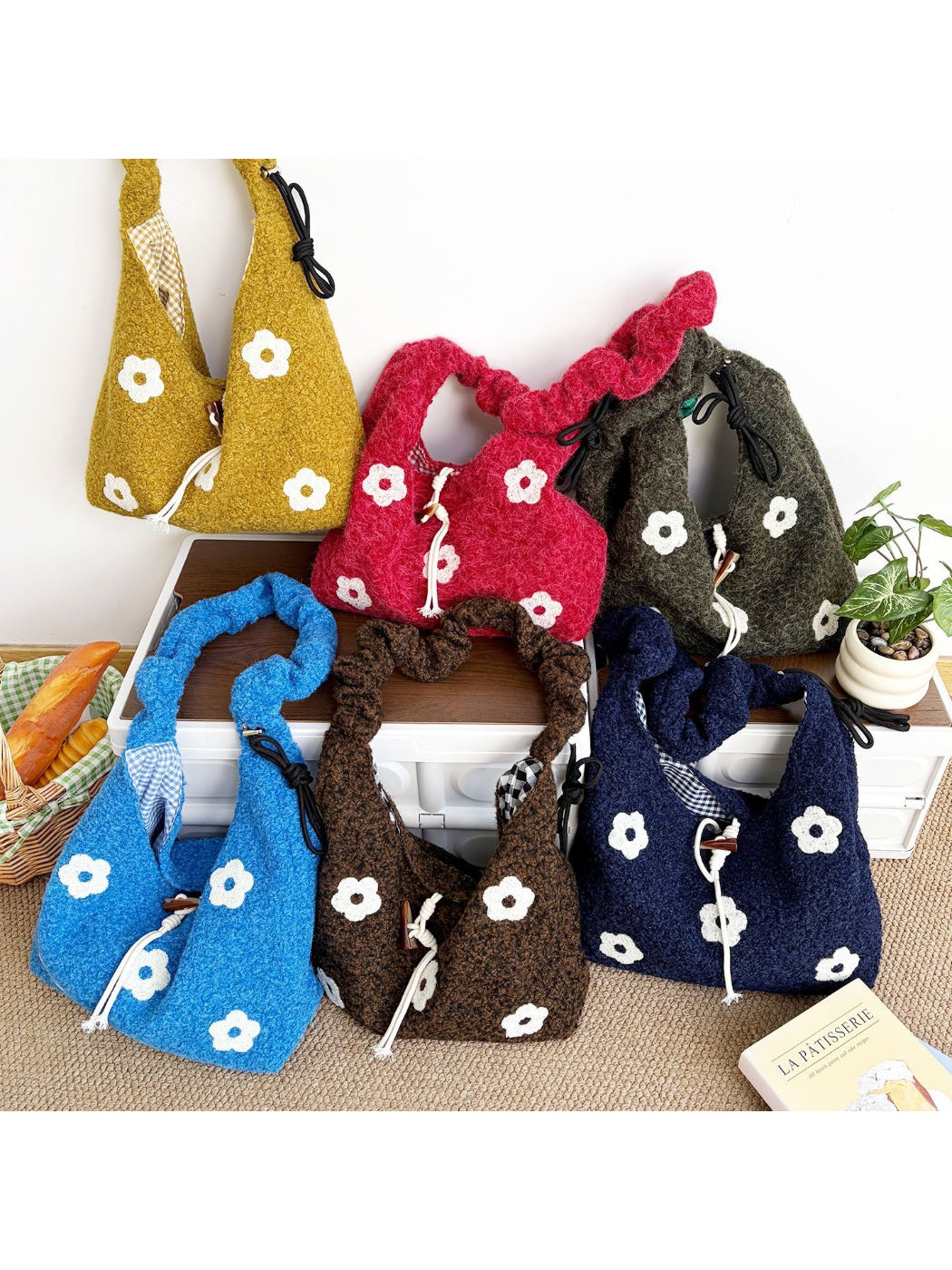 Cosbai floral knit drawstring shoulder bag in cream with multicolor flower patterns