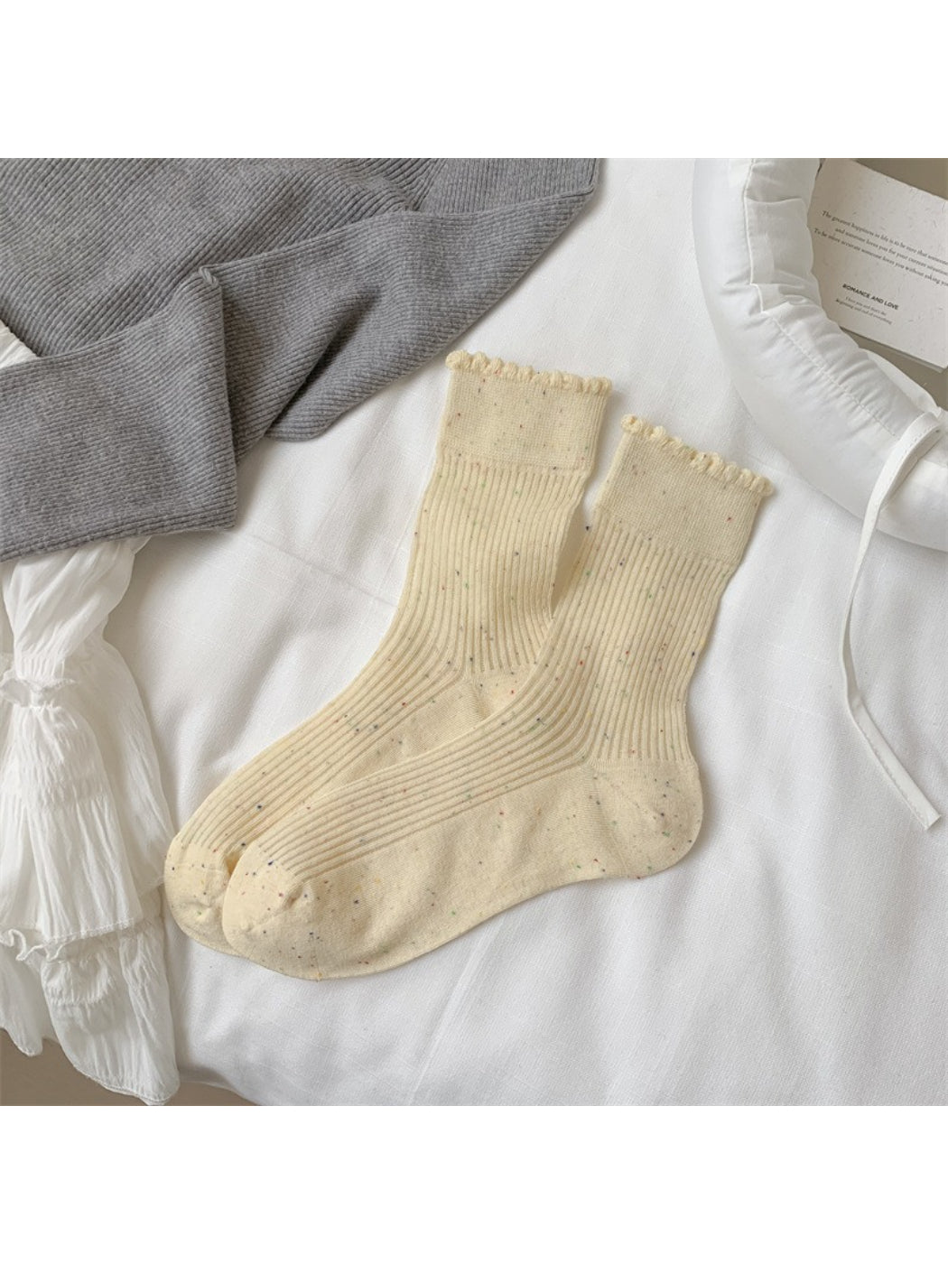 Close-up of sock heel and toe area on Rufia rib crew socks with speckled knit