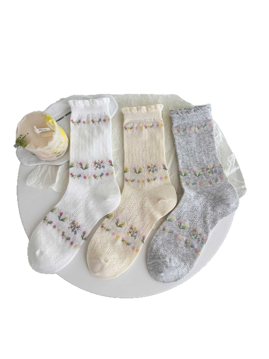 Model wearing Rufia floral lace ankle socks with casual shoes