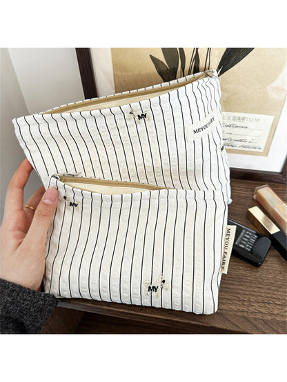 Side view of Cosbai Classic Pinstripe Cosmetic Organizer highlighting sturdy handle and