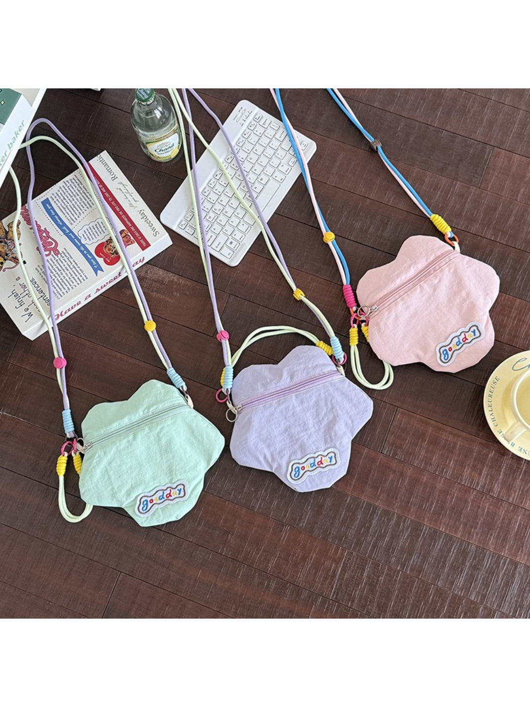 Cosbai floral mini crossbody coin pouch showing strap and compact size