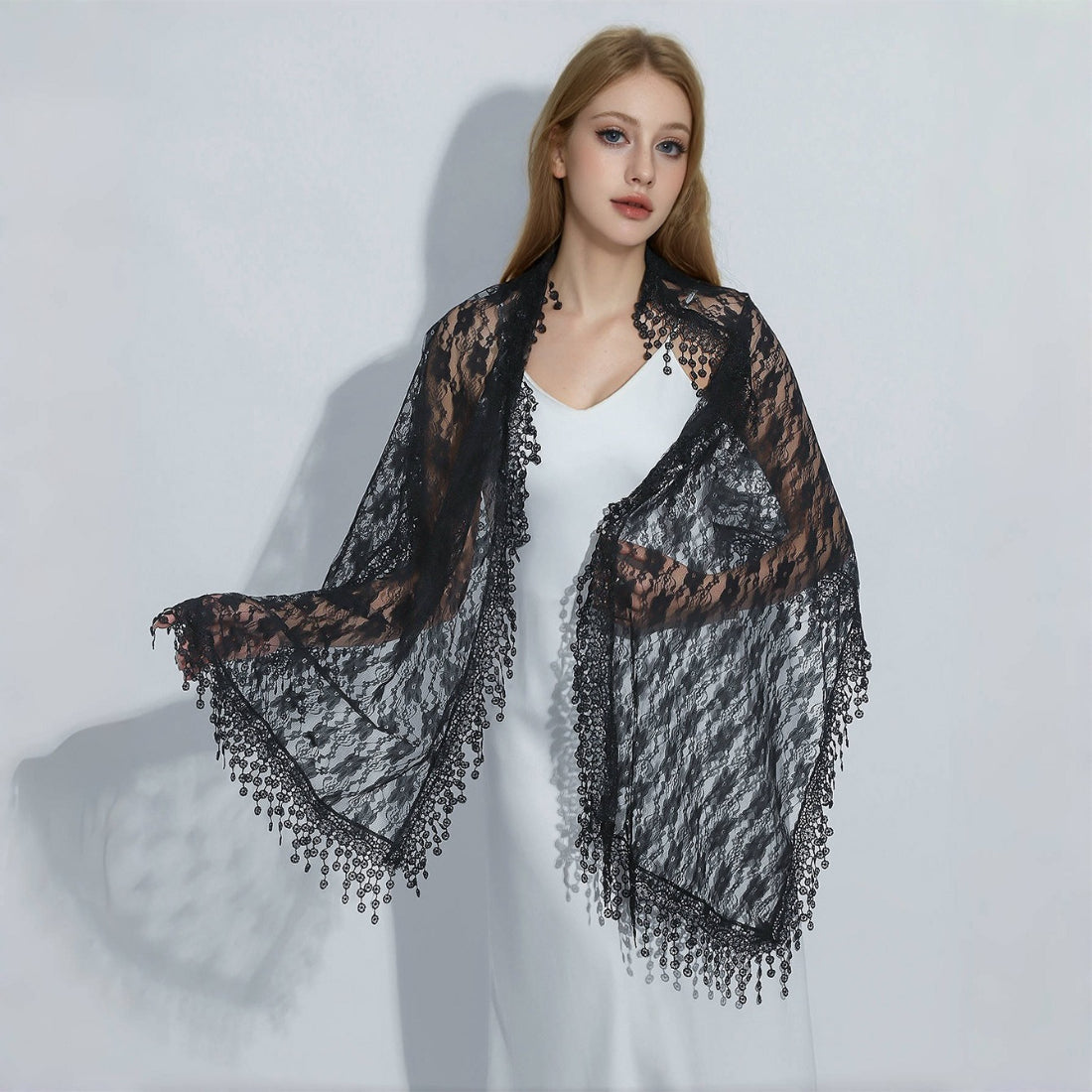 Model wearing sheer floral lace wrap scarf draped over shoulders