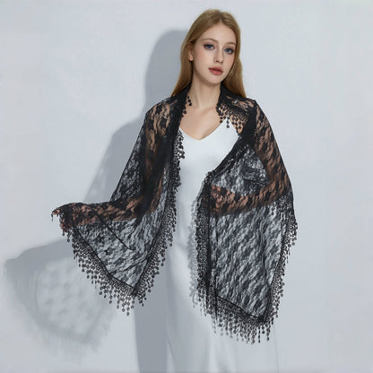Model wearing sheer floral lace wrap scarf draped over shoulders