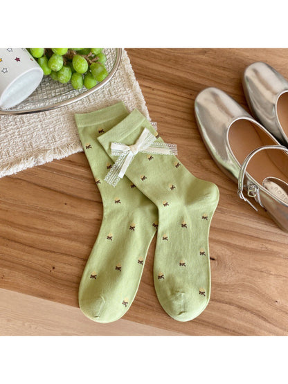 Stack of Rufia cute everyday ribbed socks in various pastel colors