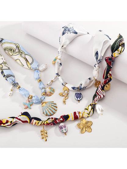 Model wearing Neckit Botanical Charm fabric necklace styled with casual outfit