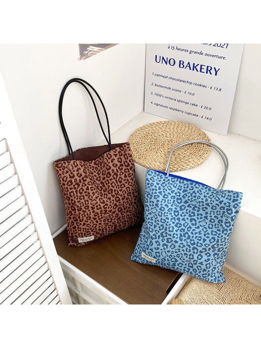 Cosbai leopard print lightweight tote bag with black handles on white background