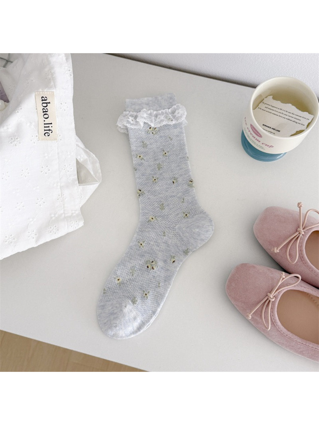 Close-up of fabric texture and lace cuff on Rufia Romantic Lace Cuff Crew Socks