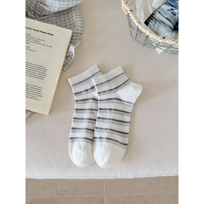 Model wearing Rufia Sweet Ribbon Accent ankle socks with casual shoes