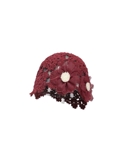 Haila openwork hat folded to show flexibility and detailed flower decoration