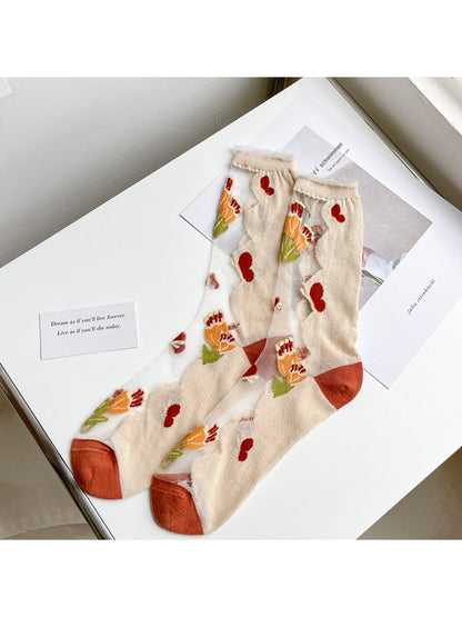 Rufia Garden Sheer Floral Crew Socks laid flat showing full floral pattern and crew length