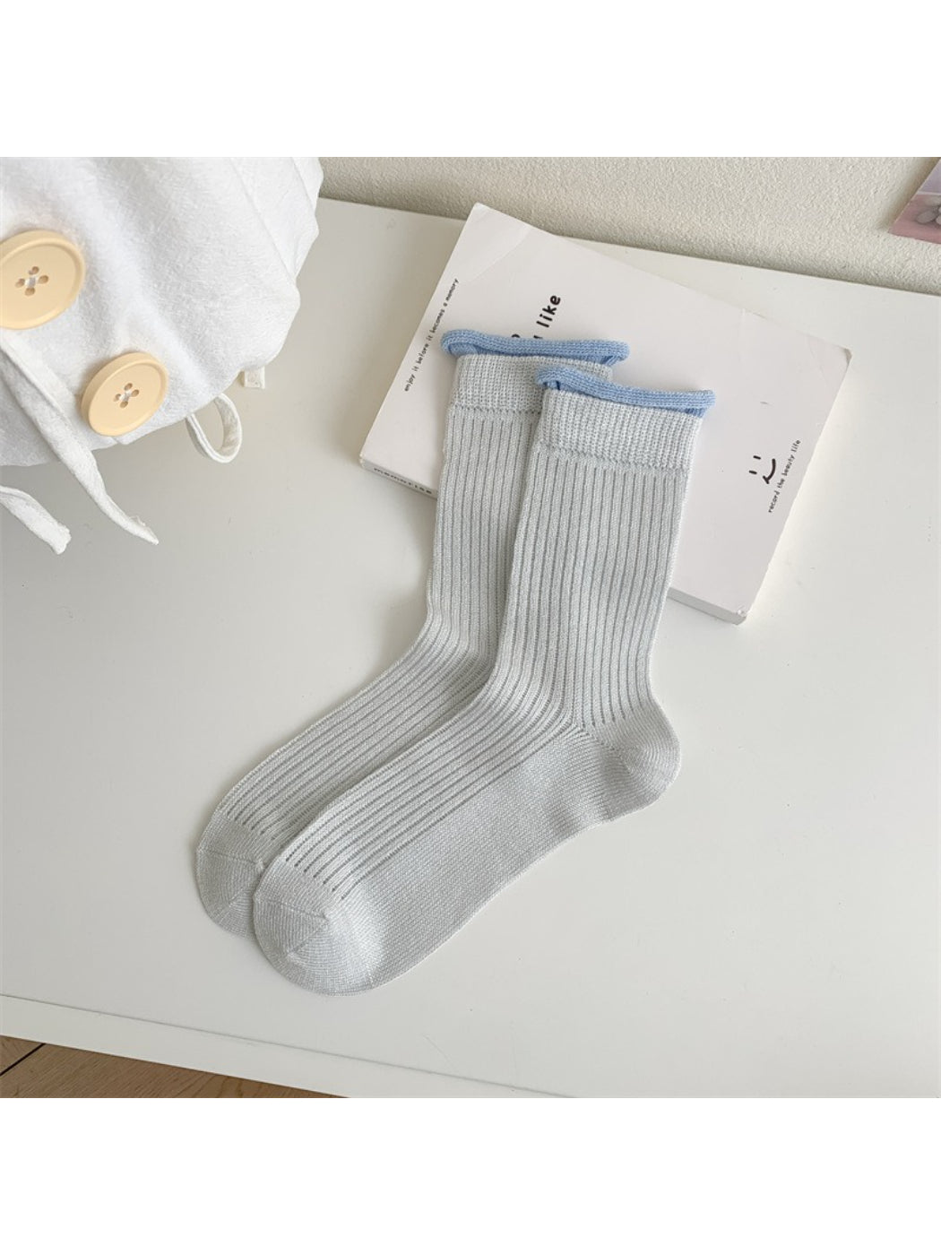 Flat lay of Rufia ribbed crew socks with pastel purple contrast trim detail