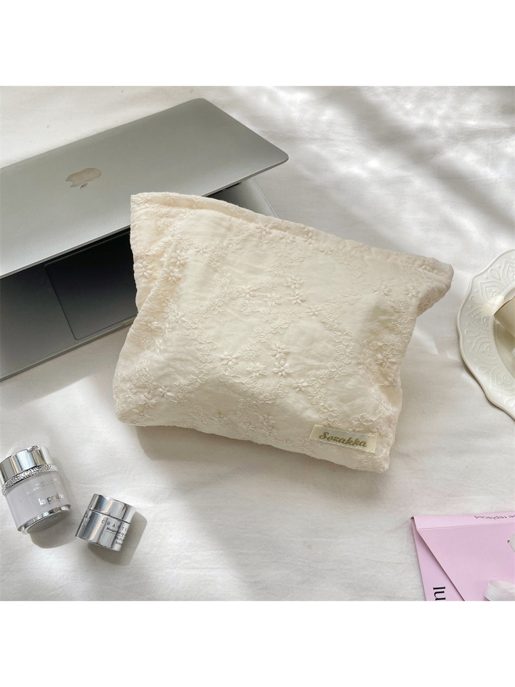 Cosbai cosmetic pouch open, displaying spacious interior for makeup storage
