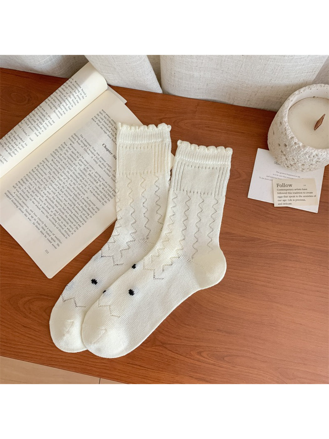 Model wearing Rufia textured crew socks with floral detail paired with casual shoes