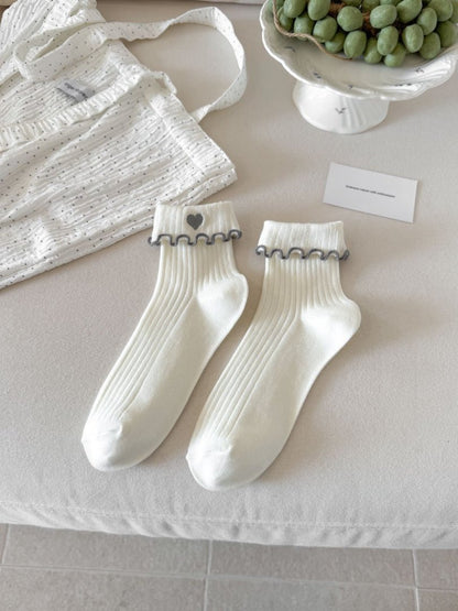 Rufia Sweet Heart Edge Ribbed Socks paired with casual shoes showing scalloped heart detail