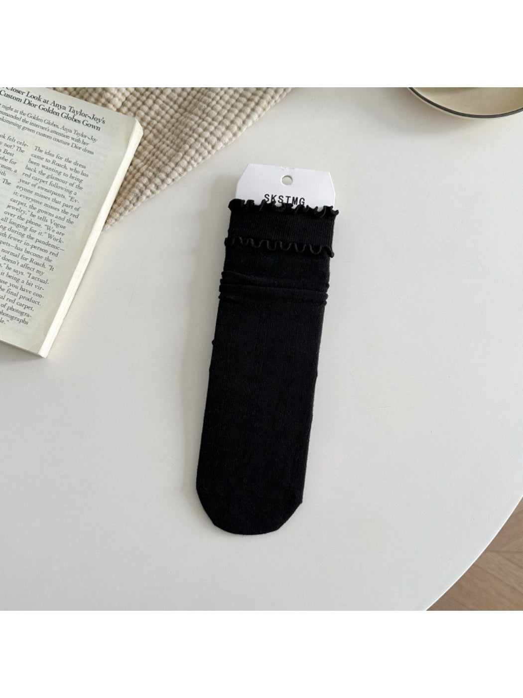 Rufia ruffle mid-calf socks in white color laid flat with ruffle detail
