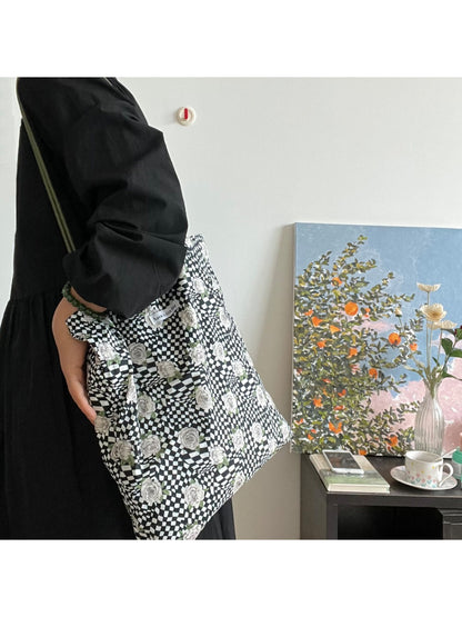 Close-up of Cosbai Checker Rose Drawstring Bag fabric texture and pattern details