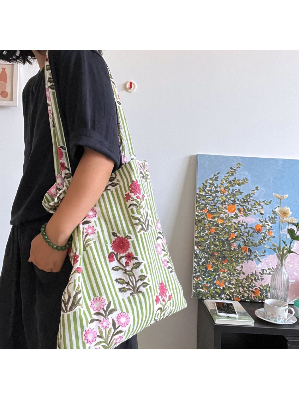 Close-up of the floral stripe pattern and rabbit charm on the Cosbai shoulder tote bag
