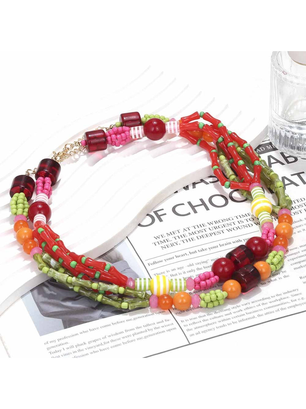 Side view of colorful layered beaded necklace highlighting bead arrangement