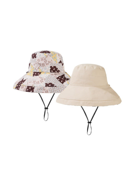 Close-up of Haila bucket hat fabric featuring detailed pink and green floral design