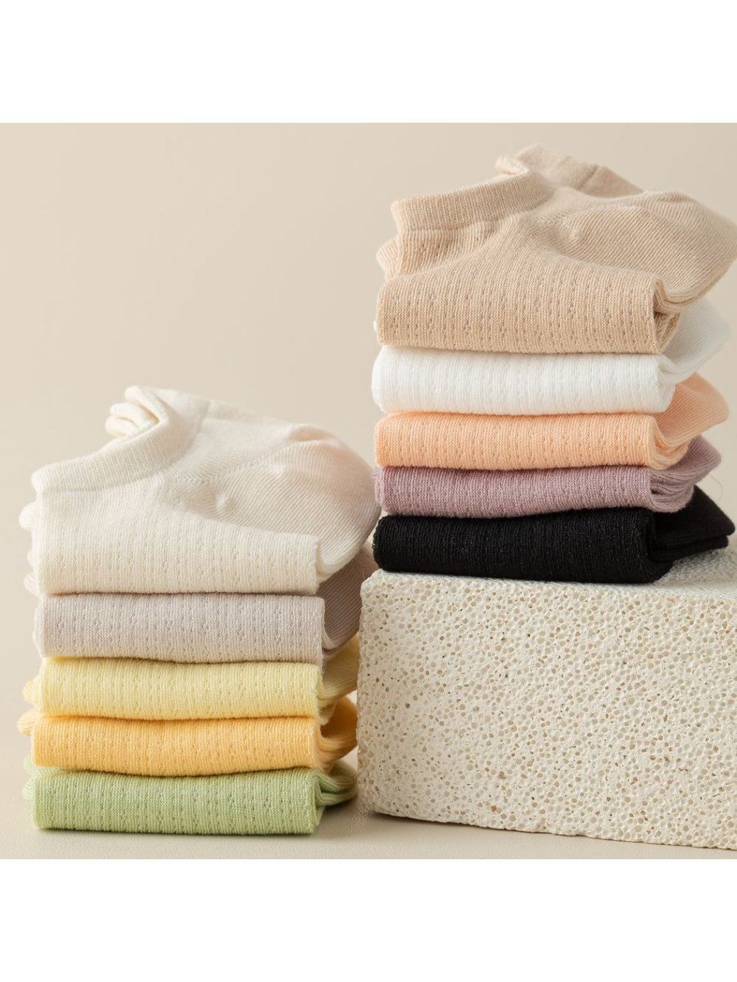 Pair of Rufia Everyday Invisible Liner Socks in beige on a white background