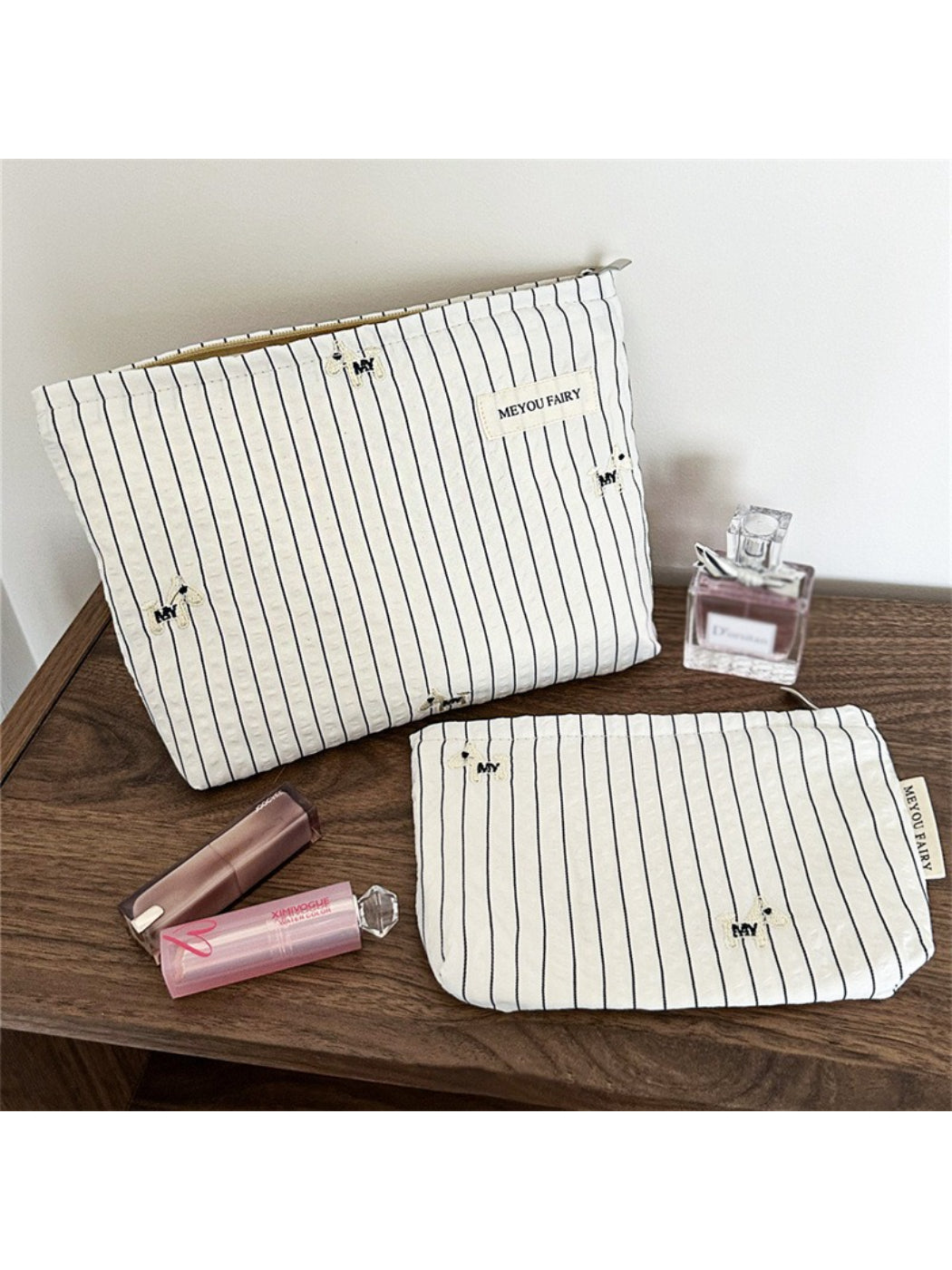 Open Cosbai Classic Pinstripe Cosmetic Organizer showing multiple and makeup products