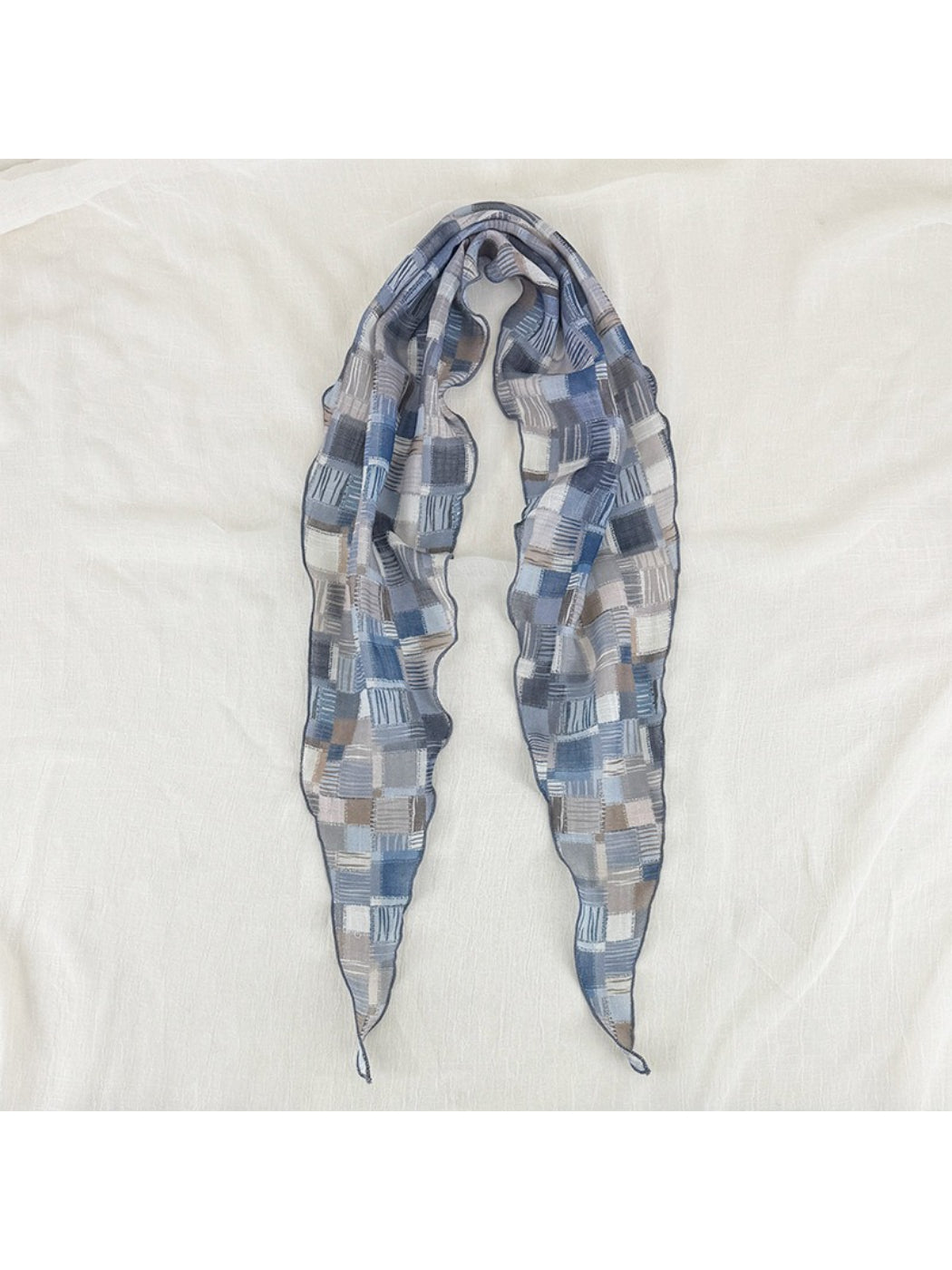 Close-up of Scarvii vintage patchwork skinny scarf showing fabric texture and stitching
