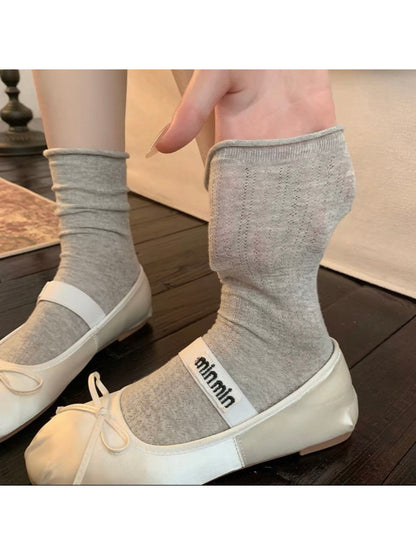 Rufia ribbed mid-calf socks stretched to show elasticity