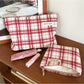 Cosbai red plaid cosmetic bag with a rectangular shape on a white background
