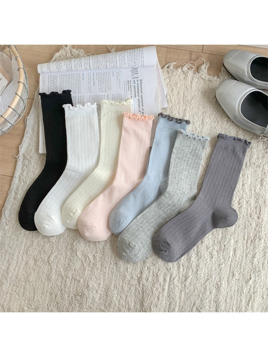Close-up of Rufia crew sock showing soft fabric and detailed frill trim edge