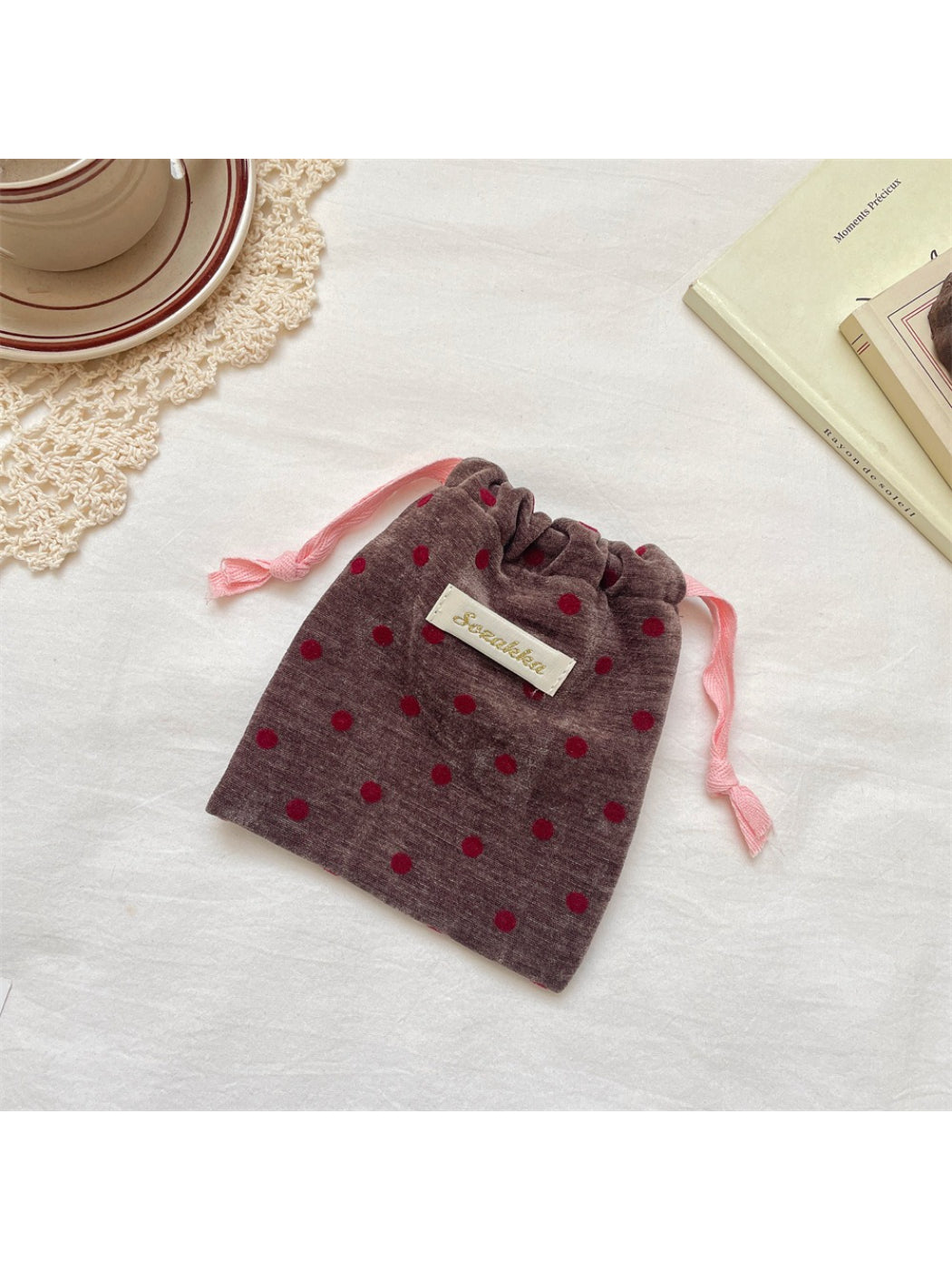 Cosbai velvet pouch displayed on a white surface highlighting soft texture