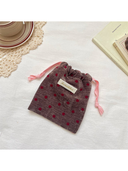 Cosbai velvet pouch displayed on a white surface highlighting soft texture