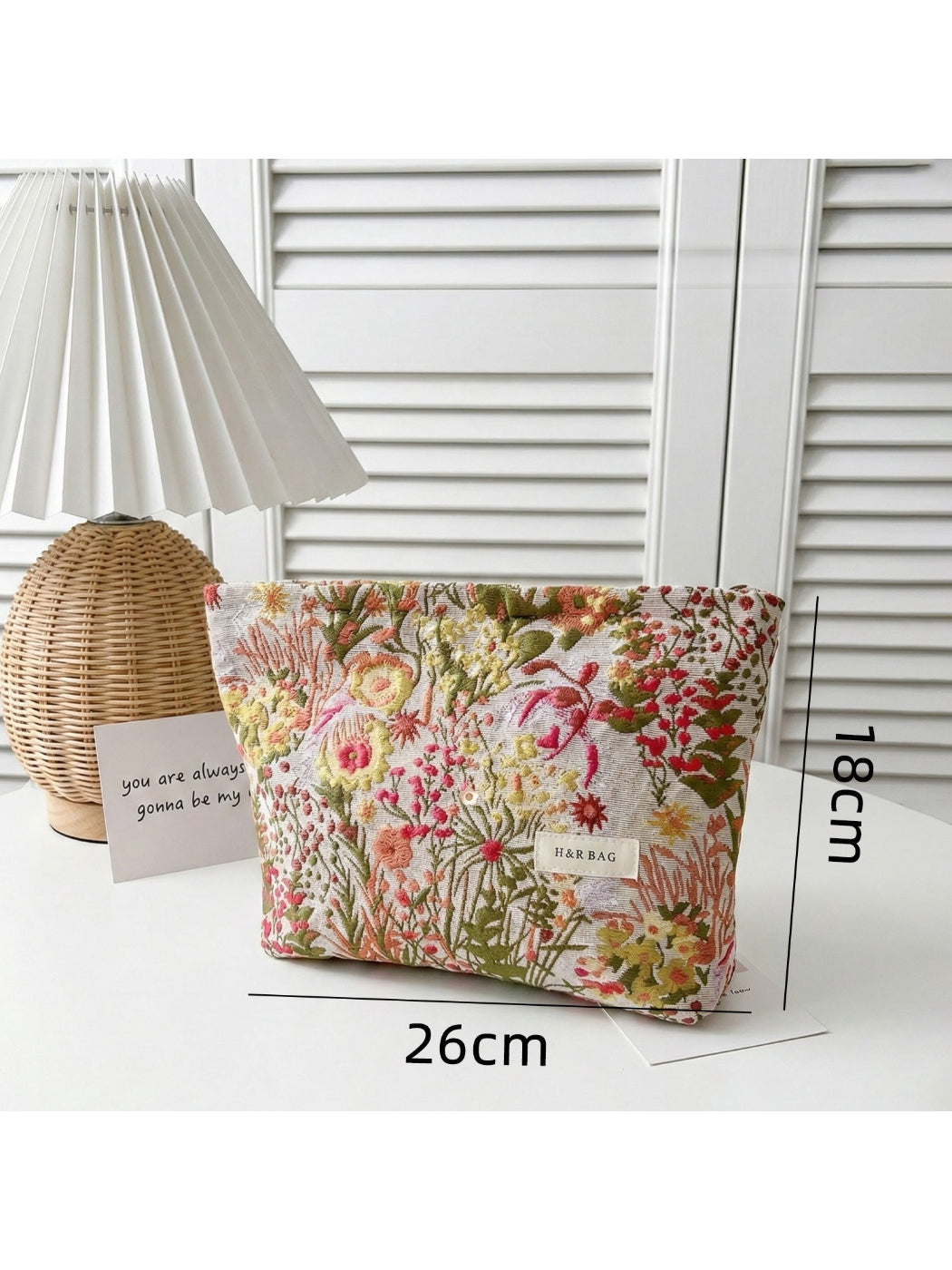 Side view of Cosbai Garden Print Cosmetic Pouch highlighting its shape and garden print