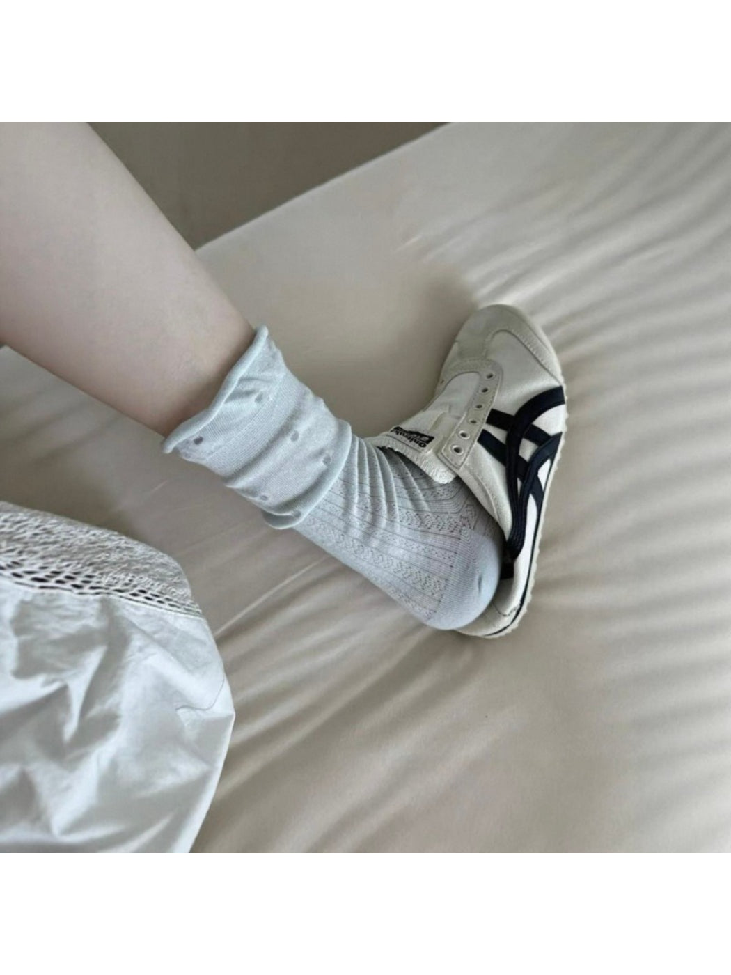 Rufia mid-calf socks with ruffle edge and mesh dot pattern displayed on a plain background