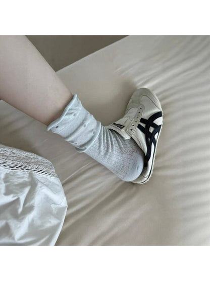 Rufia mid-calf socks with ruffle edge and mesh dot pattern displayed on a plain background